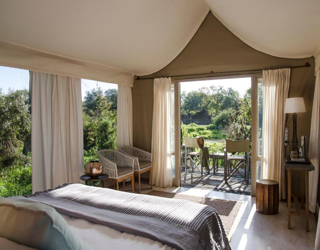 Six luxury safari tents have a king-sized bed (or twin) and a beautiful game- viewing deck with either a river or bush view. There’s a spacious en suite bathroom and dressing area with ample storage space, shower, double vanity, enclosed toilet and door out to an outdoor rain-shower as well.