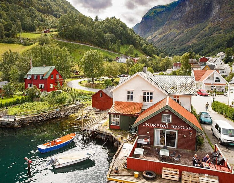 Painted houses and boats in Norwegian fjord village