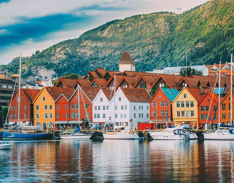 Colorful harbor houses reflected in water