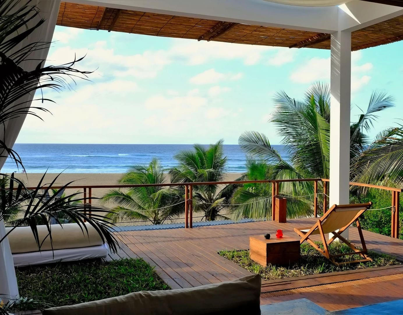 Cozy beachside view with palm trees.